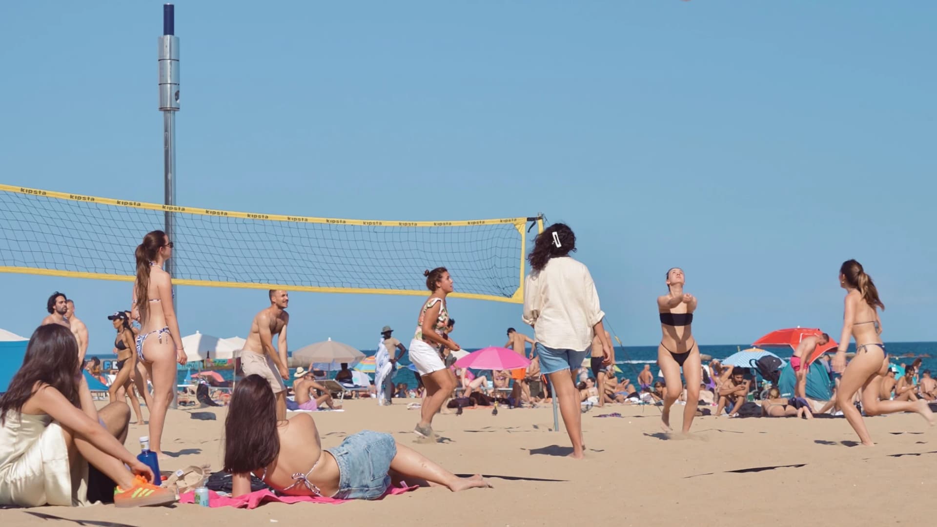 Photo source: Harbour.Space - Group of students playing volleyball